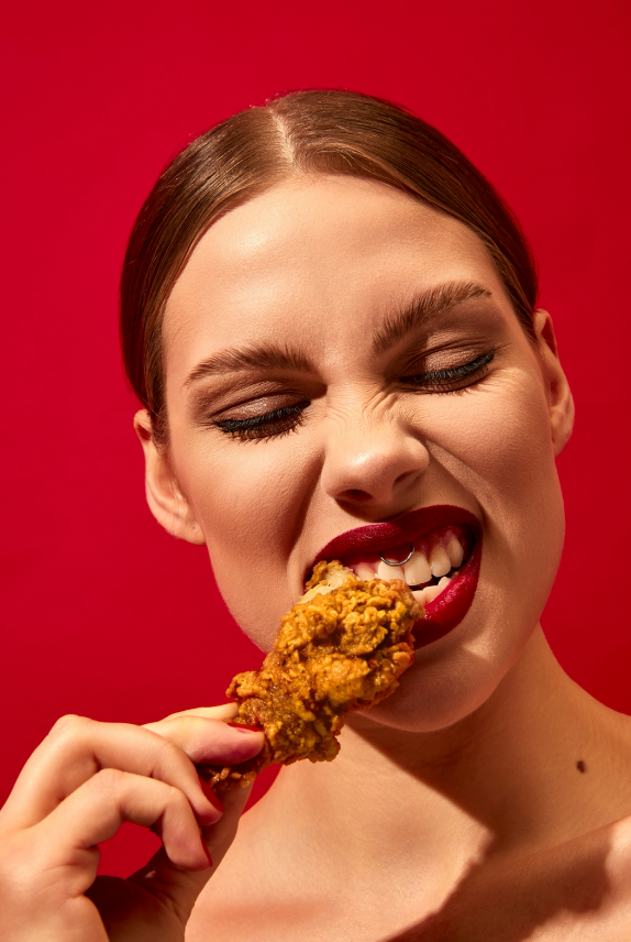 Girl eating fried chicken